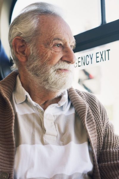 Old,Man,,Thinking,And,Travel,On,Bus,Ride,To,Destination